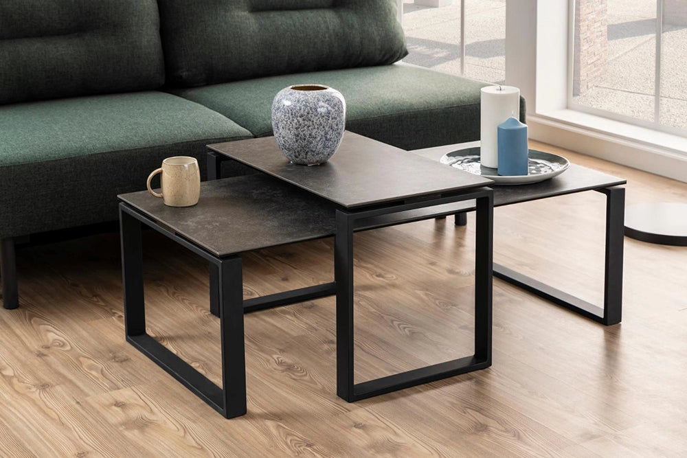 Trina Coffee Table Grey in Black Finish with Modular Sofa and White Candle in Living Room Setting