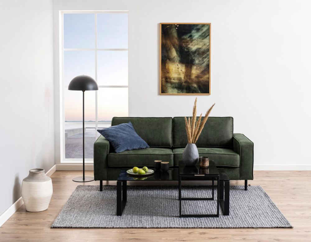 Trina Coffee Table Smoked Glass and Black with Sofa and Floor Lamp in Living Room Setting