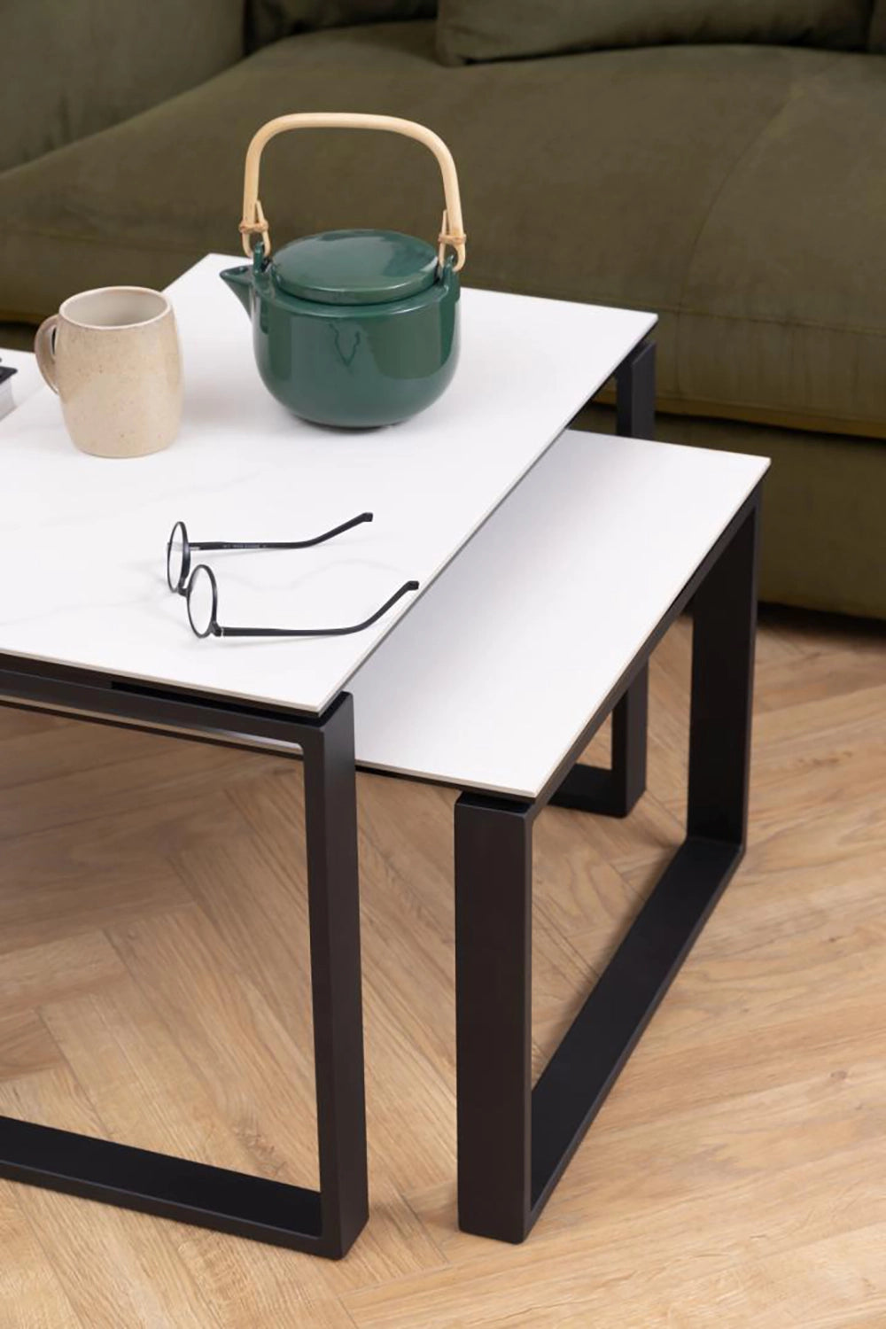 Trina Coffee Table in Marble Black Finish with Upholstered Sofa and Eyeglass in Living Room Setting