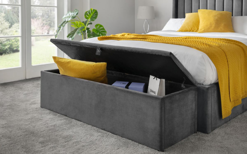 Verona Upholstered Blanket Box in Dark Grey Finish with Throw and Indoor Plant in Bedroom Setting