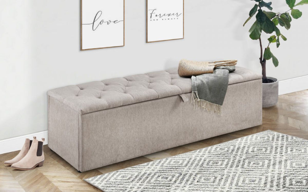 Verona Upholstered Blanket Box in Mink Finish with Indoor Plant and Rug in Living Room Setting