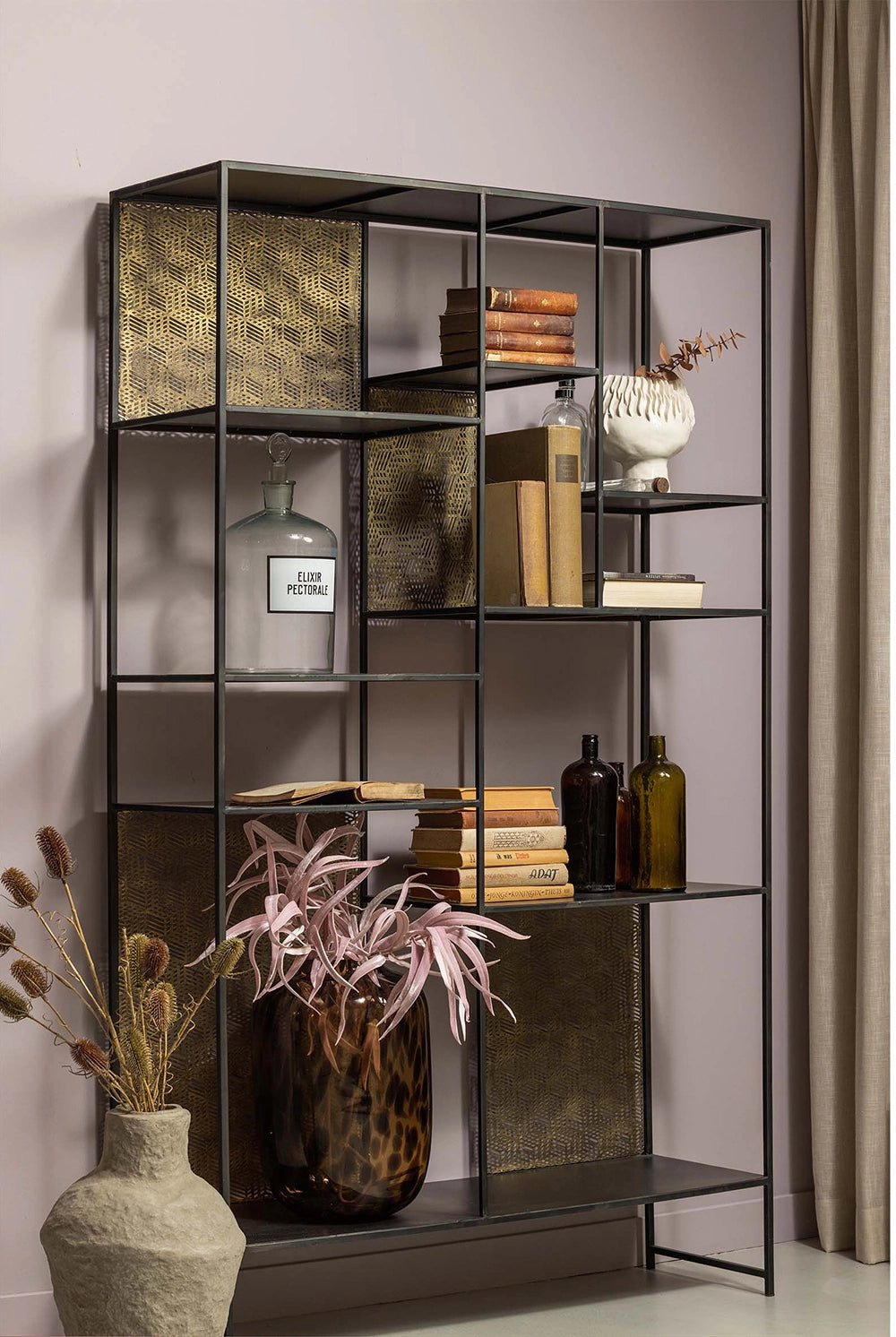 Viktor Display Cabinet in - Black/Antique Brass Finish with Vase and Books in Living Room Setting
