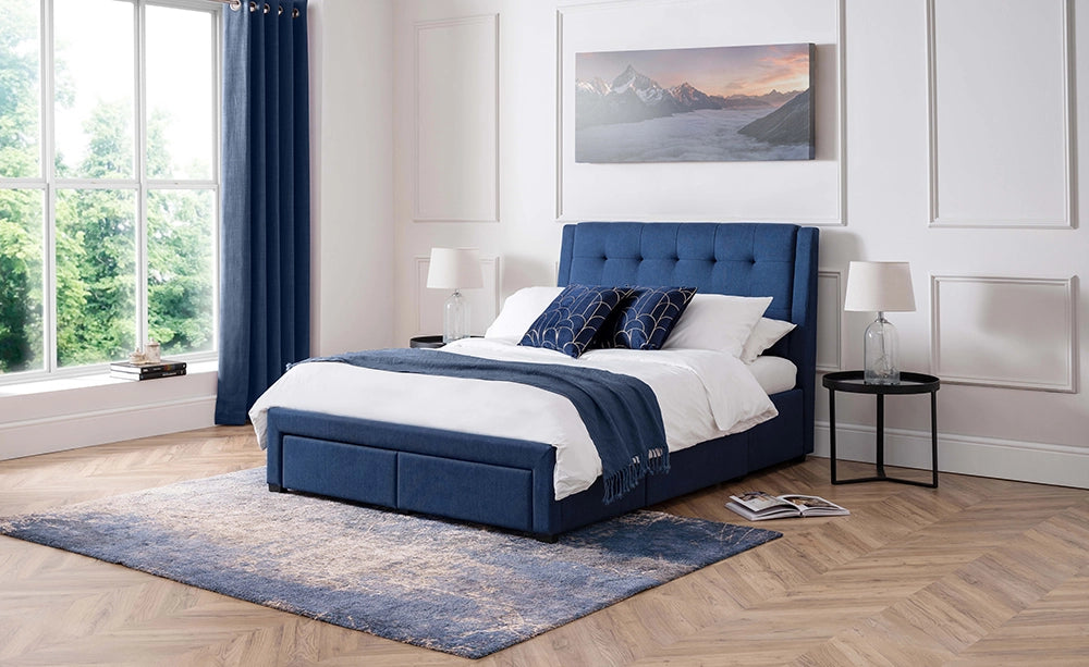 Violet 4 Drawer Bed in Blue Finish with White Lamp Shade and Carpet in Bedroom Setting