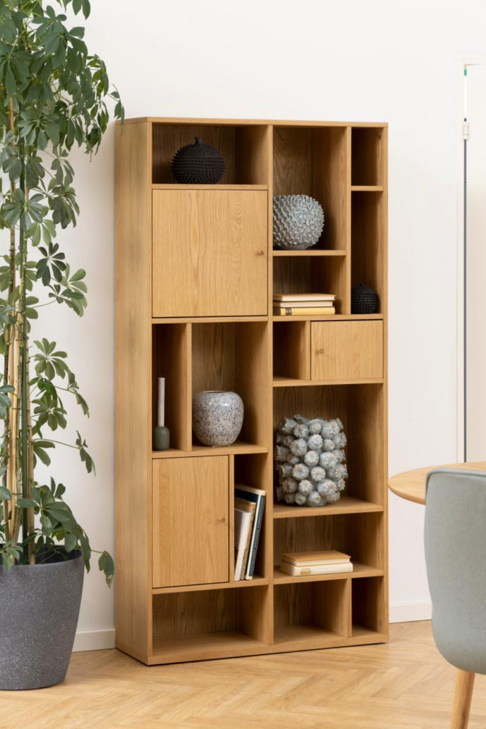 Yangon Wooden Bookcase with Indoor Plant in Dining Setting