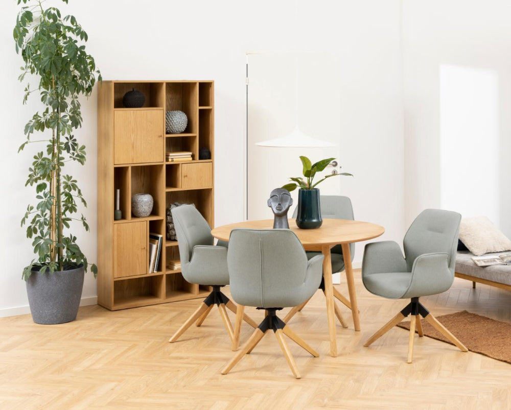 Yangon Wooden Bookcase with Round Table and Indoor Plant in Breakout Setting